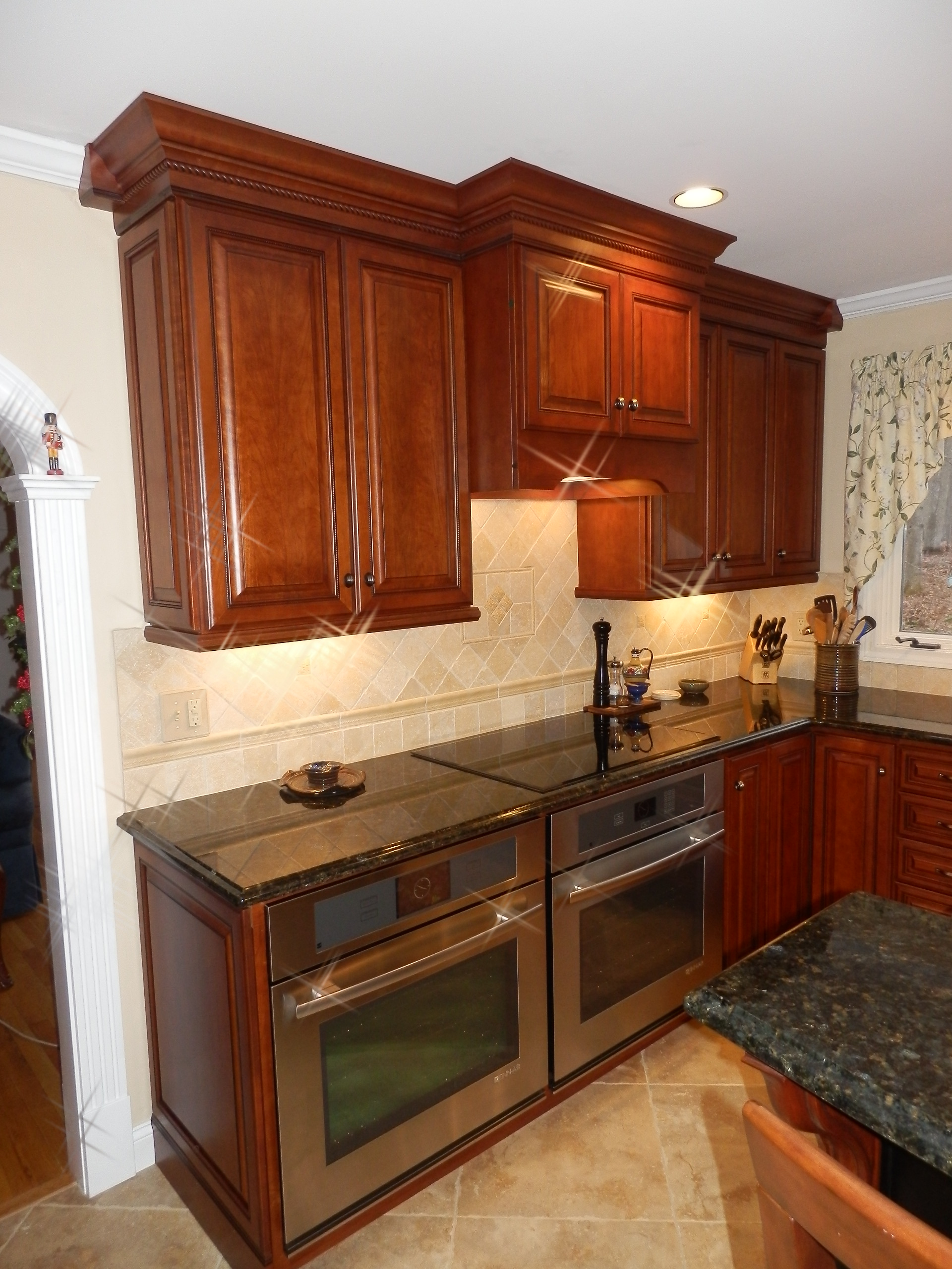 Traditional look of raised panel cherry Kitchen Design Center